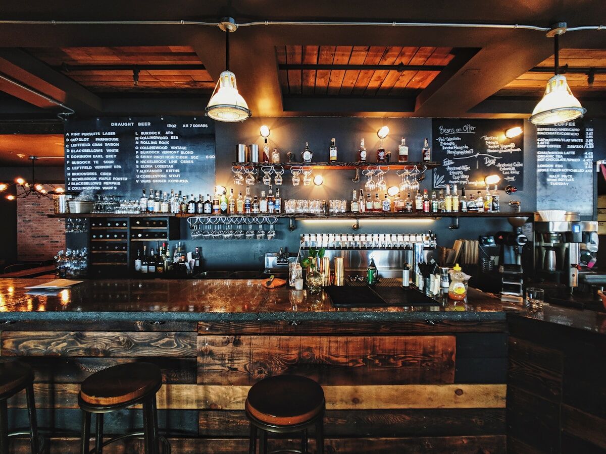 The bar at Casa Demo under warm pendant lights